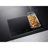 AEG IKE85651 80cm Multibridge Induction Hob from HomeWise Appliances stock photo showing the hob in a worktop surround with large cookware.